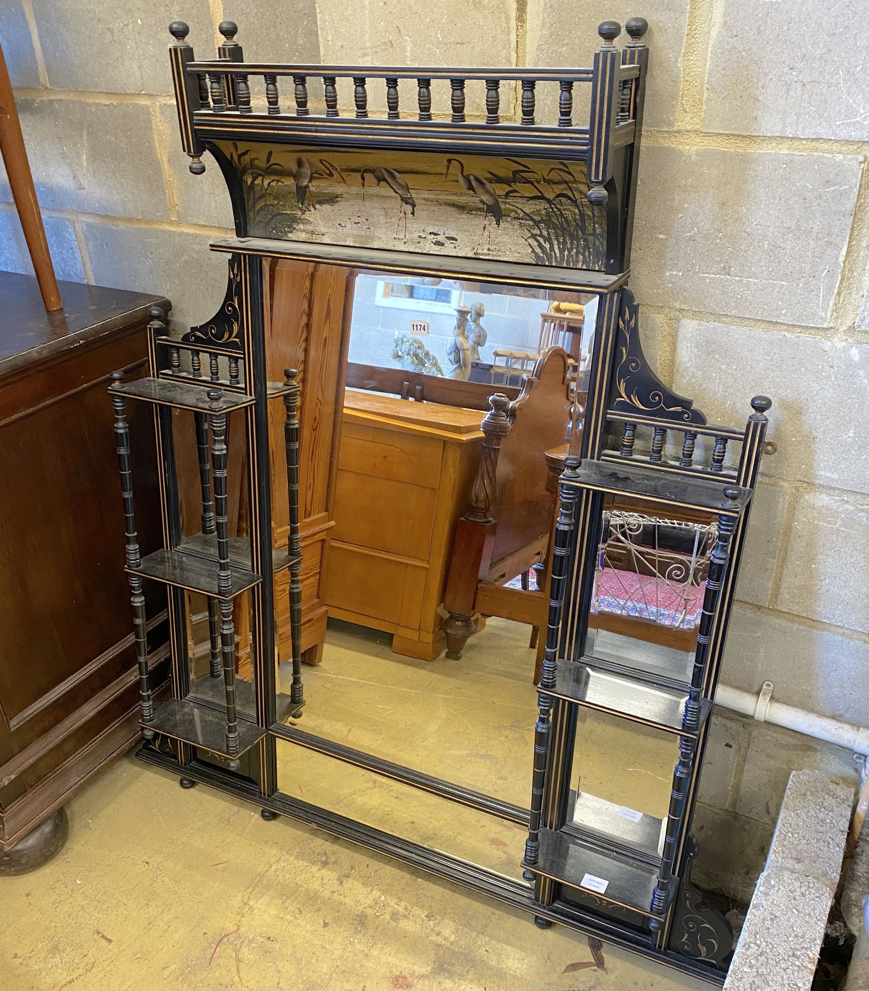 A late Victorian Aesthetic Movement parcel gilt ebonised over-mantel mirror, width 134cm, height 153cm